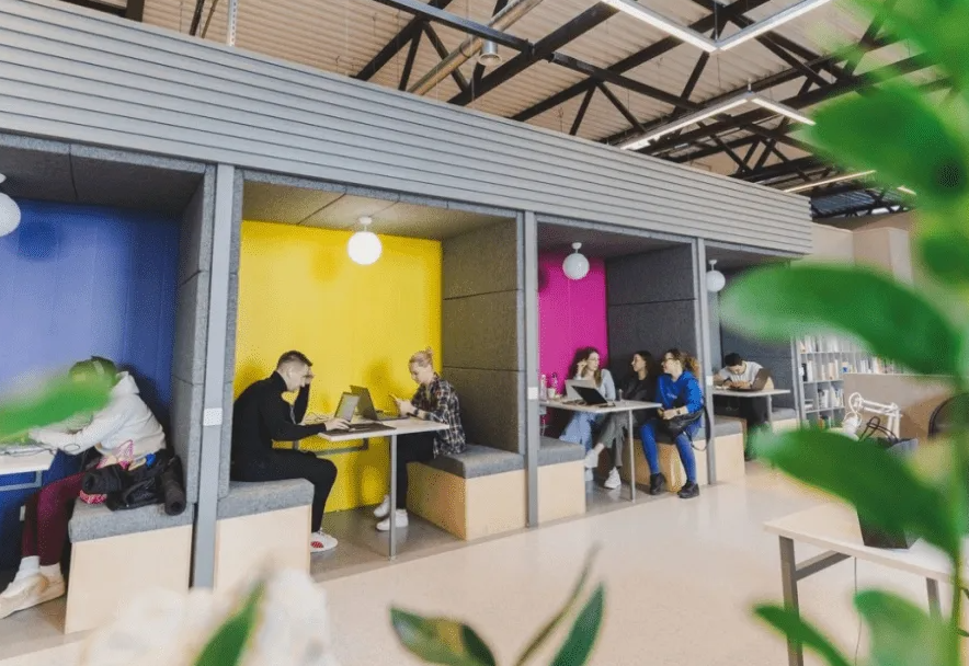 Coworking collaboration zone with comfortable seating and meeting points